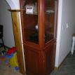 Glass hutch cabinet by doorway